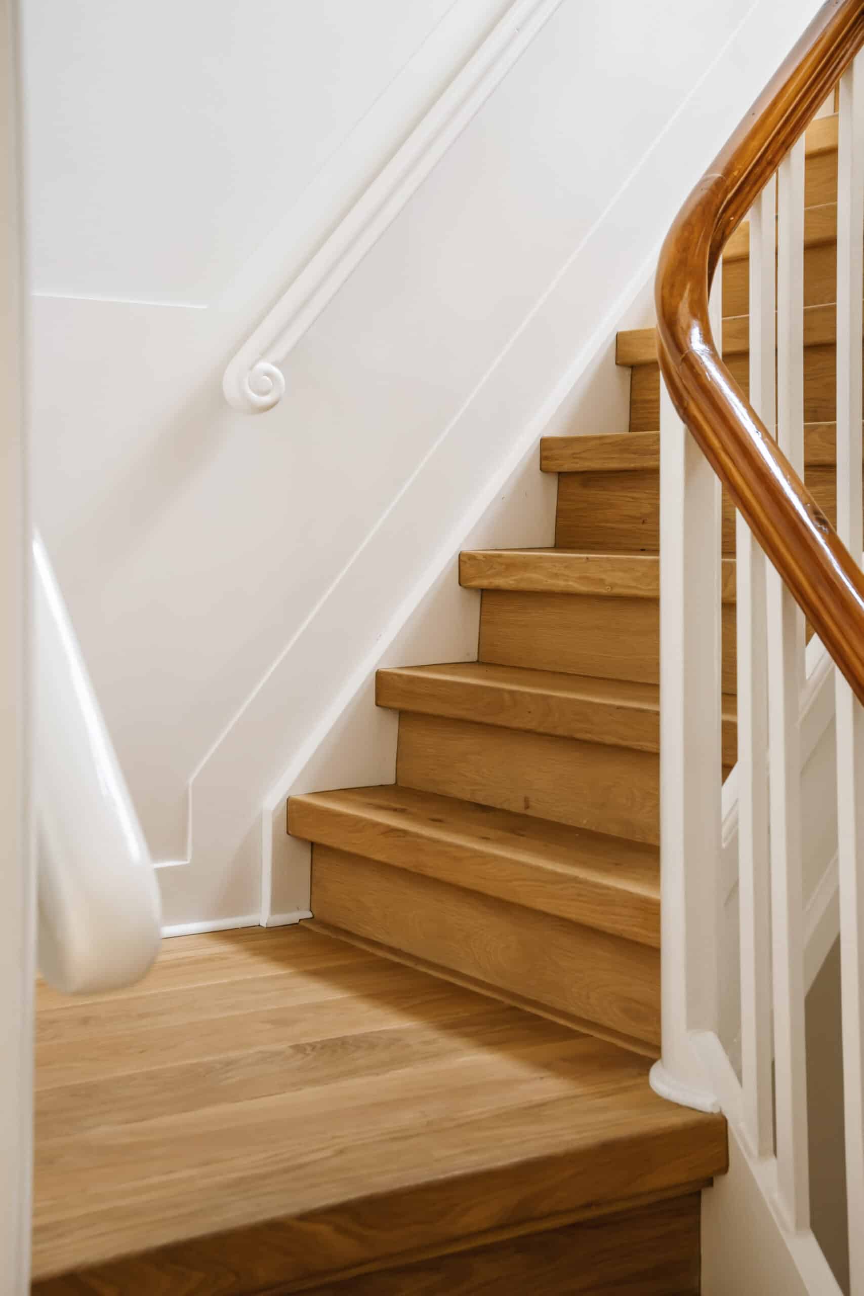 Amazing design of a wooden staircase with comfortable handrails in an elite house
